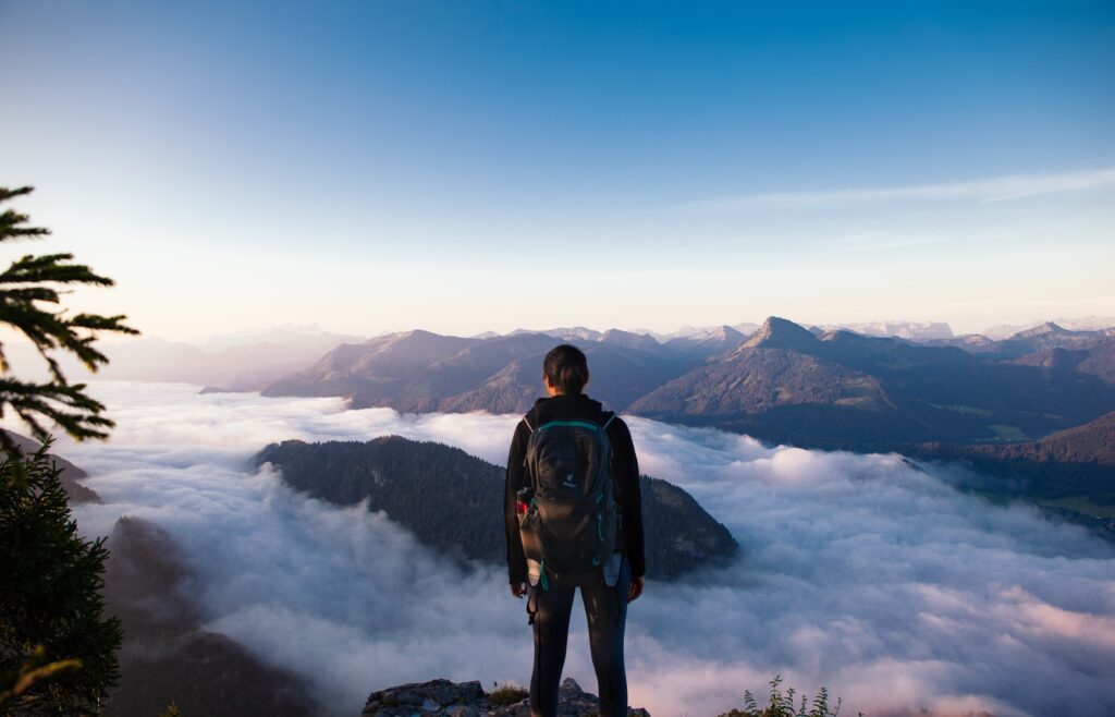 Man standing on top of a mountain