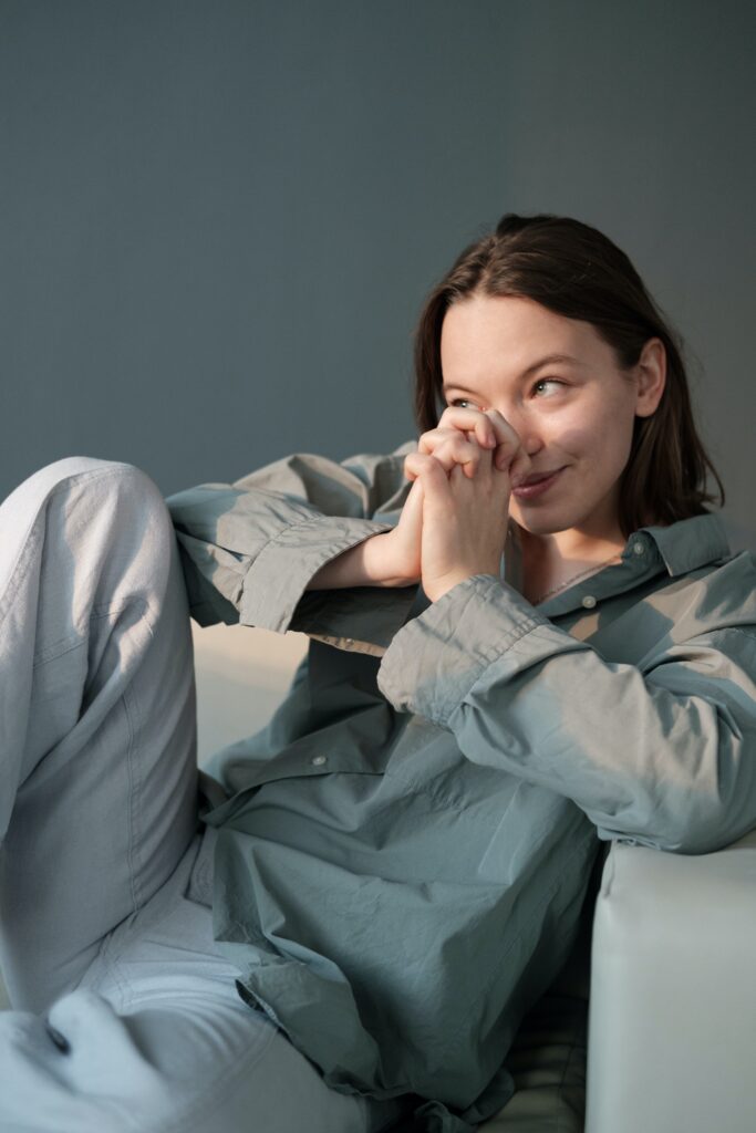 woman holdiing her hands close to her face