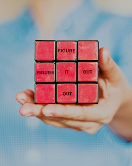 a cube labeled "figure it out" represents solution-focused therapy for trauma